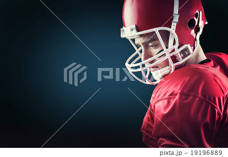 Composite image of concentrated american football player 19196889