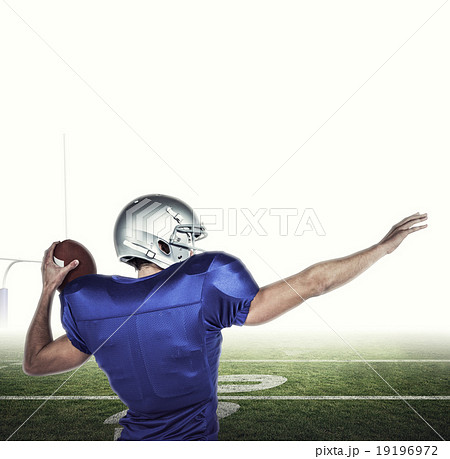 Composite image of rear view of american football player throwin Composite image of rear view of american football player throwin 19196972