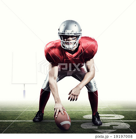 Composite image of american football player holding helmet Composite image of american football player holding helmet 19197008