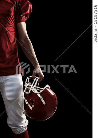 Composite image of an american football player taking his helmet Composite image of an american football player taking his helmet 19197516
