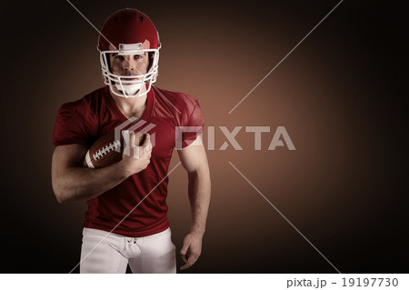 Composite image of american football player with ball 19197730