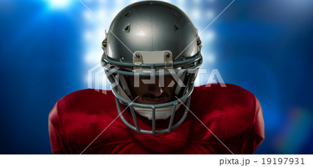 Composite image of close-up of serious american football player Composite image of close-up of serious american football player 19197931