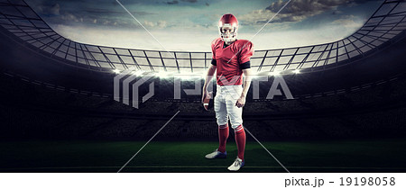 Composite image of portrait of american football player holding 19198058