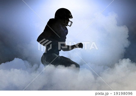 Composite image of silhouette american football player runing 19198096