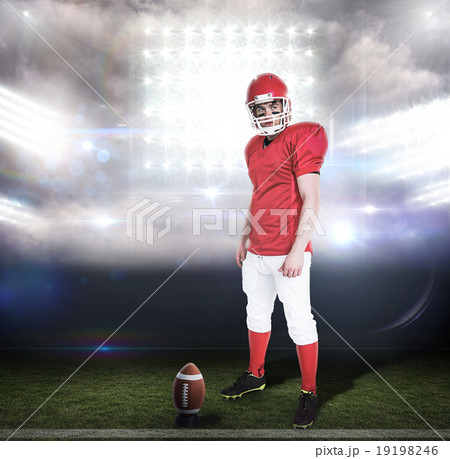Composite image of serious american football player wearing a he Composite image of serious american football player wearing a he 19198246