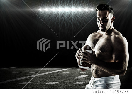 Composite image of shirtless american football player with ball Composite image of shirtless american football player with ball 19198278