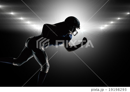 Composite image of silhouette american football player running 19198293