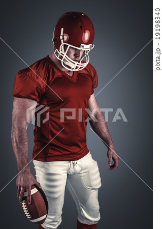 Composite image of american football player with ball Composite image of american football player with ball 19198340