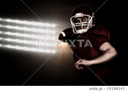 Composite image of american football player throwing a ball Composite image of american football player throwing a ball 19198341