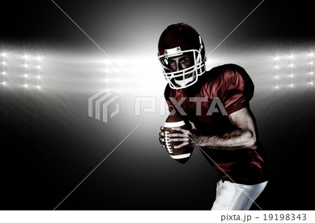 Composite image of player holding rugby ball and posing Composite image of player holding rugby ball and posing 19198343