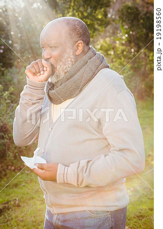 Senior man coughing with tissue 19198560