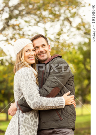 Portrait of smiling young couple embracing 19198640