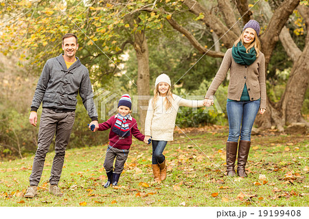 Smiling young family posing together 19199408