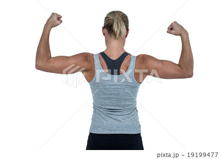 Rear view of muscular woman flexing muscles 19199477