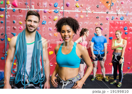 Fit people getting ready to rock climb 19199810