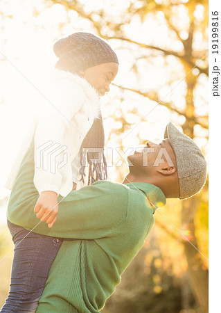 Young father holding his daughter 19199816