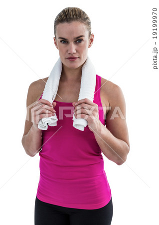 Muscular woman holding a towel around her neck Muscular woman holding a towel around her neck 19199970