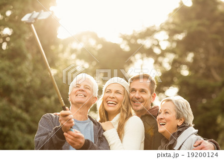 Smiling small family taking selfies 19200124
