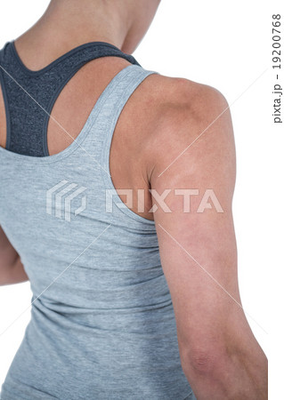 Rear view of muscular woman looking down 19200768