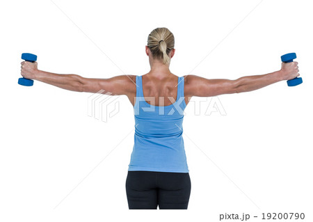 Muscular woman exercising with dumbbells 19200790