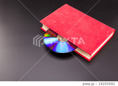 Cd is sticks out from red book Cd is sticks out from red book 19203092