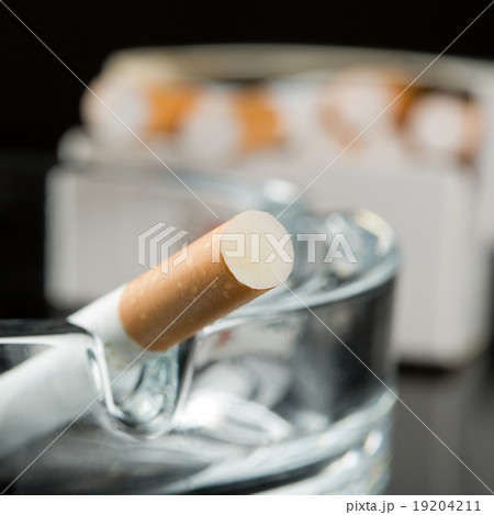 Cigarette on ashtray 19204211