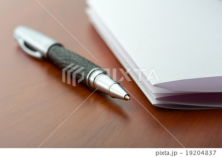 Sheet of paper and pen 19204837