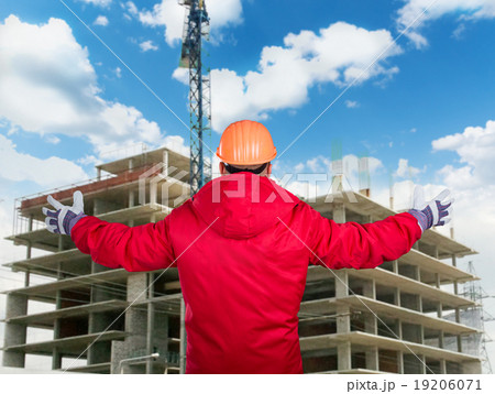 Builder at work with concrete construction 19206071