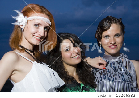 Three retro girlfriends in the evening 19206532