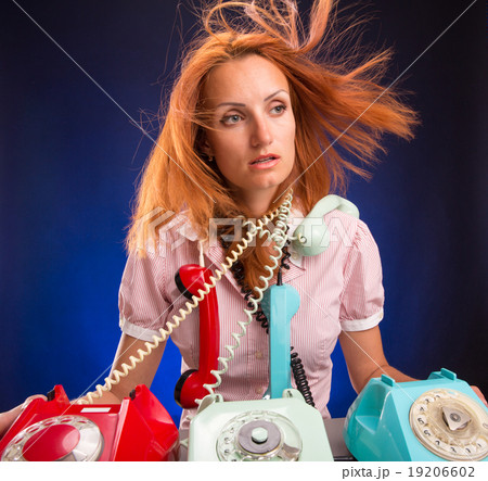 Stressed girl with phones 19206602