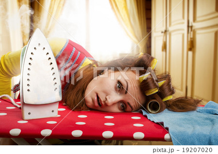 Tired housewife with ironing-board Tired housewife with ironing-board 19207020