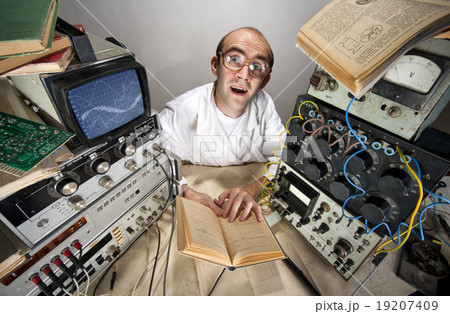 Funny timid scientist reading book 19207409