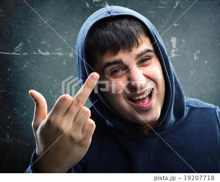 Man in hoodie with rude sign 19207718