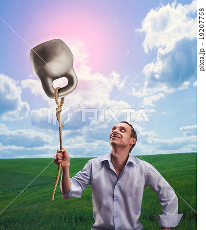 Strange dreamy man with a kettlebell 19207768