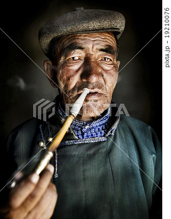 Mongolian Traditional Dress Smoking Pipe Solitude Concept Mongolian Traditional Dress Smoking Pipe Solitude Concept 19210076