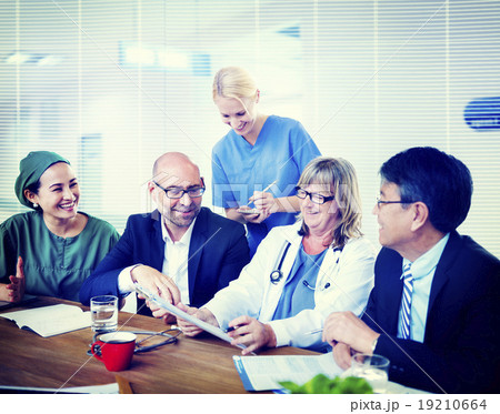 Group Of General Practitioners Having A Meeting Group Of General Practitioners Having A Meeting 19210664