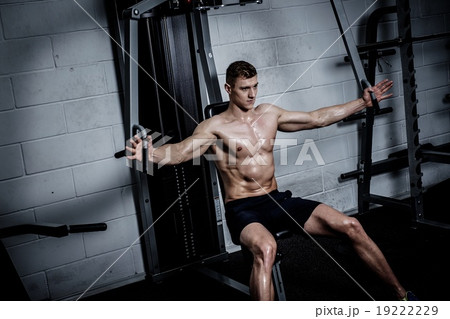 Athletic man doing exercises Athletic man doing exercises 19222229