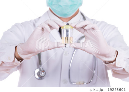 doctor's hand holding a bottle of urine doctor's hand holding a bottle of urine 19223601