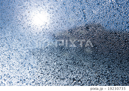Water drop on glass Water drop on glass 19230735