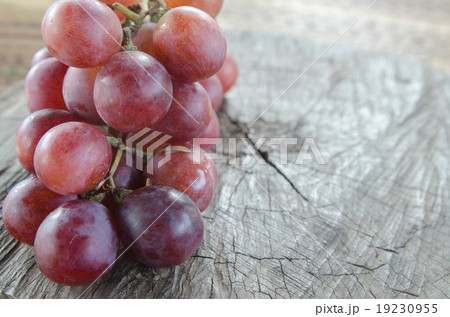 grapes on a wooden table grapes on a wooden table 19230955
