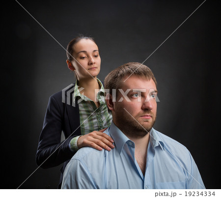 Businesswoman behind businessman Businesswoman behind businessman 19234334