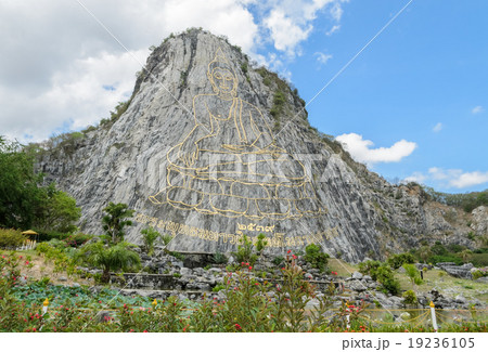 Carved buddha image on the cliff  19236105