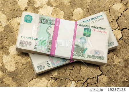 Pile of money in wrapper Pile of money in wrapper 19237128