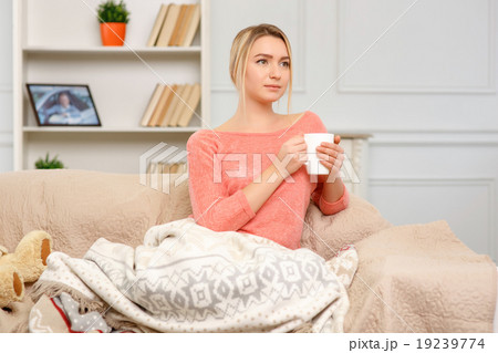 Young pleasant woman drinking tea. 19239774