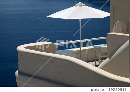 White umbrella on balcony resort house, Santorini White umbrella on balcony resort house, Santorini 19240911
