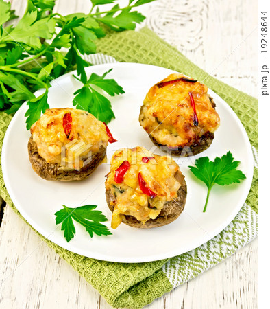 Champignons stuffed meat in white plate on napkin 19248644