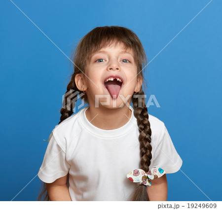 happy lost tooth girl portrait, studio shoot  19249609