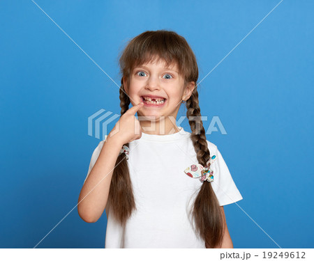happy lost tooth girl portrait, studio shoot  19249612