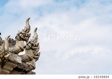 Naga statue in thai temple on blue sky background Naga statue in thai temple on blue sky background 19249894