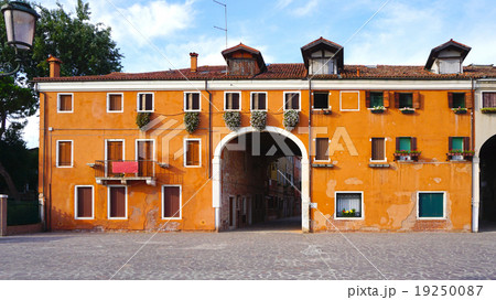 orange color old charming building orange color old charming building 19250087